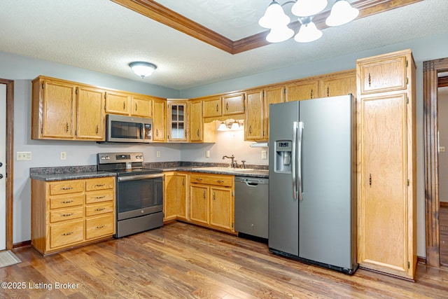 1117 Breezy Way, Bardstown, KY 40004 - kitchen with stainless steel appliances, dark countertops, a chandelier, wood finished floors, and a textured ceiling