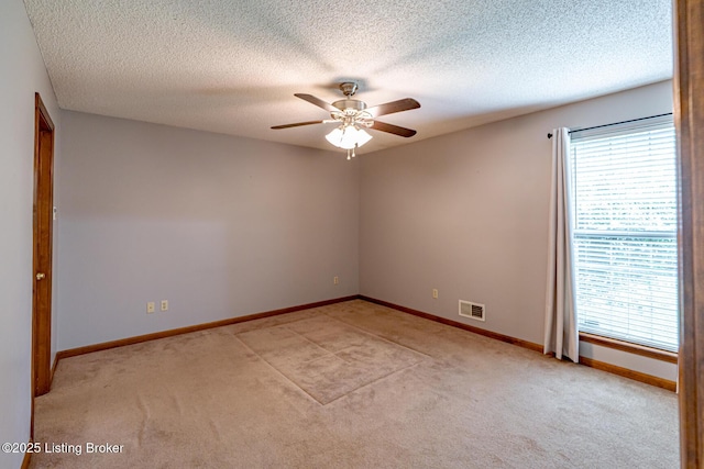 1117 Breezy Way, Bardstown, KY 40004 - unfurnished room with healthy amount of natural light, light colored carpet, a ceiling fan, and a textured ceiling