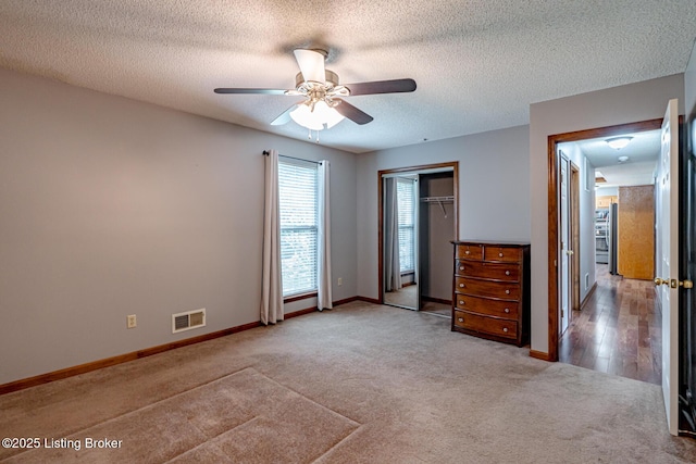 1117 Breezy Way, Bardstown, KY 40004 - unfurnished bedroom featuring carpet flooring, a closet, fridge, a textured ceiling, and a ceiling fan
