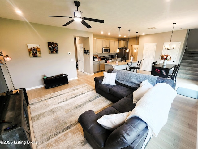 309 Knowledge Point Path, Shelbyville, KY 40065 - living room with light wood-style flooring, ceiling fan, stairs, recessed lighting, and a chandelier