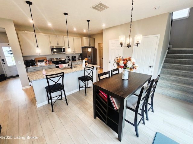 309 Knowledge Point Path, Shelbyville, KY 40065 - dining space with light wood-style floors, stairway, recessed lighting, and a chandelier