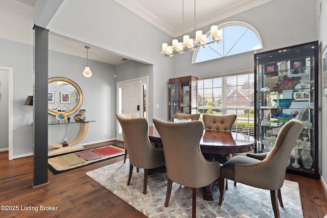 1406 Rutland Club Ct, Louisville, KY 40245 - dining space with ornamental molding, a chandelier, wood finished floors, baseboards, and a towering ceiling