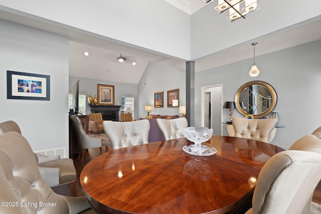 1406 Rutland Club Ct, Louisville, KY 40245 - dining space with high vaulted ceiling, wood finished floors, and decorative columns