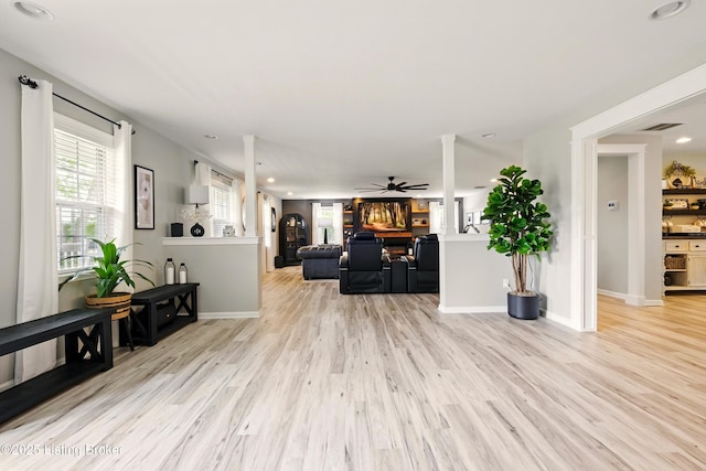 1717 Stricker Rd, Memphis, IN 47143 - living area with wood finished floors, recessed lighting, ceiling fan, and baseboards