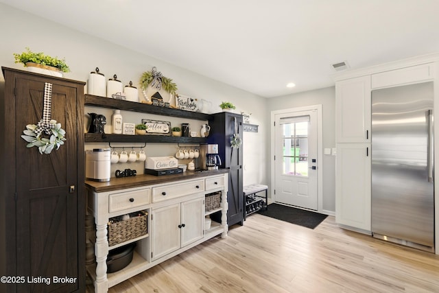 1717 Stricker Rd, Memphis, IN 47143 - bar area featuring built in fridge, light wood-style flooring, and recessed lighting