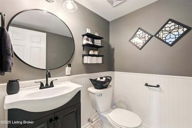1717 Stricker Rd, Memphis, IN 47143 - bathroom featuring wainscoting, vanity, and toilet