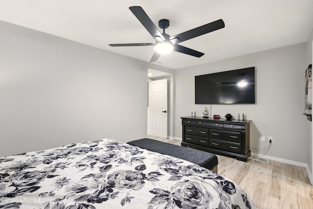 1717 Stricker Rd, Memphis, IN 47143 - bedroom featuring light wood finished floors, baseboards, and a ceiling fan