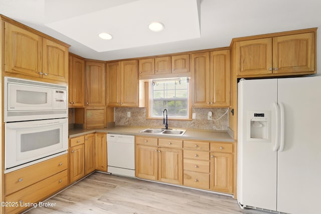 1717 Stricker Rd, Memphis, IN 47143 - kitchen featuring white appliances, a sink, backsplash, light wood-style flooring, and recessed lighting