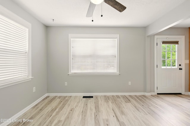 1717 Stricker Rd, Memphis, IN 47143 - spare room featuring light wood-style flooring, ceiling fan, and baseboards