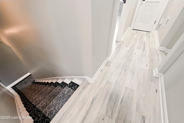 1717 Stricker Rd, Memphis, IN 47143 - stairs with wood finished floors and baseboards