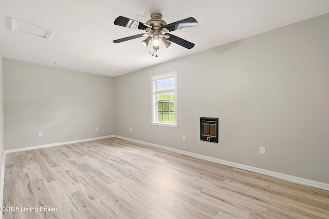 1717 Stricker Rd, Memphis, IN 47143 - unfurnished room with light wood-style flooring, a ceiling fan, baseboards, and a textured ceiling