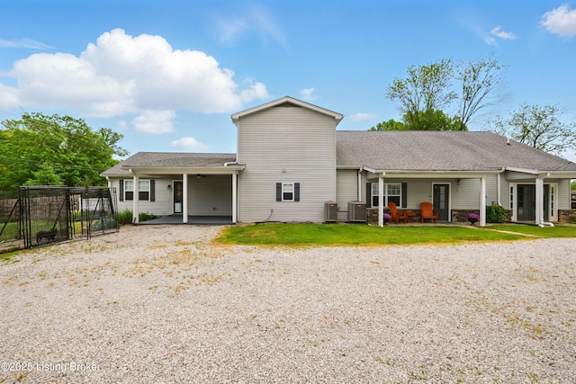 1717 Stricker Rd, Memphis, IN 47143 - rear view of house with driveway, a patio area, central AC, and a carport