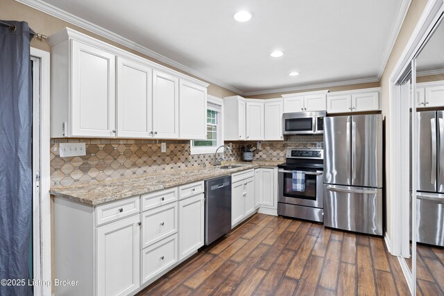 90 Shellys Trce, Brandenburg, KY 40108 - kitchen featuring stainless steel appliances, a sink, dark wood-type flooring, white cabinets, and crown molding