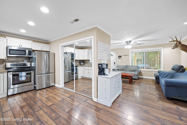 90 Shellys Trce, Brandenburg, KY 40108 - kitchen with stainless steel appliances, open floor plan, crown molding, tasteful backsplash, and white cabinets