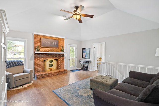 14312 Micawber Way, Louisville, KY 40245 - living area with a ceiling fan, wood finished floors, vaulted ceiling, and a brick fireplace