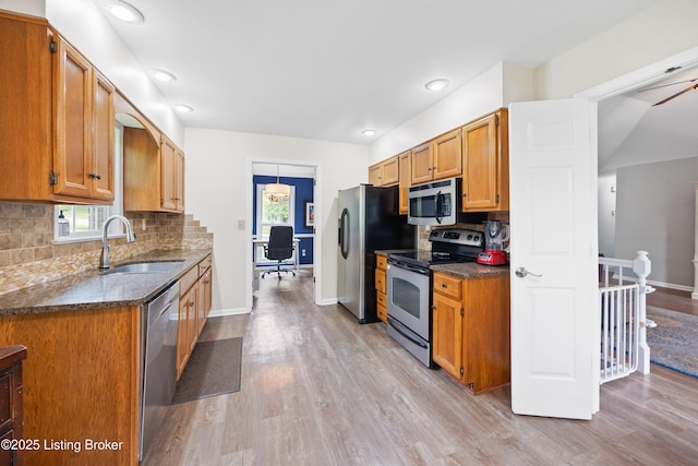 14312 Micawber Way, Louisville, KY 40245 - kitchen featuring appliances with stainless steel finishes, a sink, baseboards, light wood finished floors, and recessed lighting
