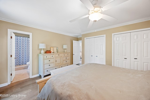 14312 Micawber Way, Louisville, KY 40245 - bedroom featuring crown molding, wood finished floors, multiple closets, baseboards, and ceiling fan