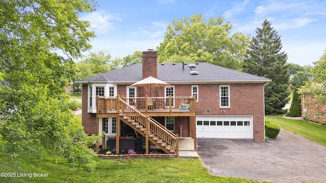 14312 Micawber Way, Louisville, KY 40245 - rear view of house featuring stairs, driveway, a garage, brick siding, and a chimney