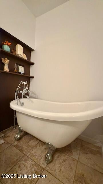 187 Glenn Rd, Leitchfield, KY 42754 - bathroom featuring tile patterned floors and a freestanding bath