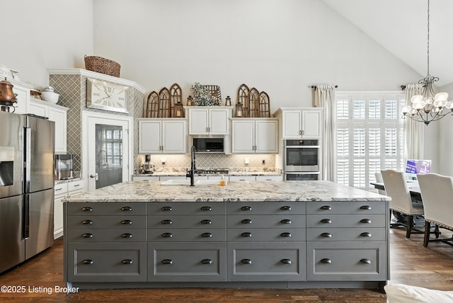 13127 Wilhoyte Ct Unit 13127, Prospect, KY 40059 - kitchen featuring gray cabinets, stainless steel appliances, high vaulted ceiling, white cabinets, and a chandelier