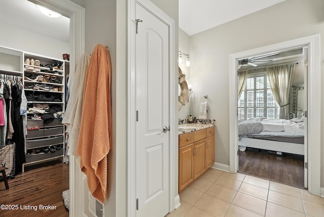 13127 Wilhoyte Ct Unit 13127, Prospect, KY 40059 - bathroom with vanity, ensuite bathroom, tile patterned flooring, a spacious closet, and ceiling fan