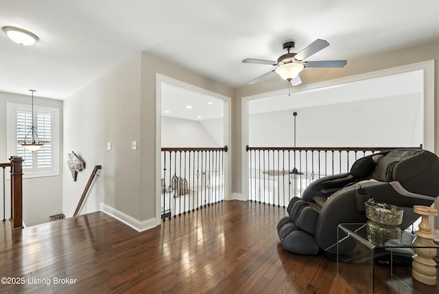 13127 Wilhoyte Ct Unit 13127, Prospect, KY 40059 - living area featuring a ceiling fan, hardwood / wood-style flooring, and an upstairs landing
