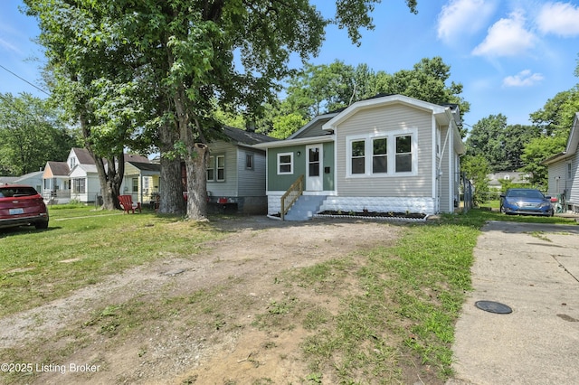220 N 39th St, Louisville, KY 40212 - view of front facade featuring entry steps and a front yard