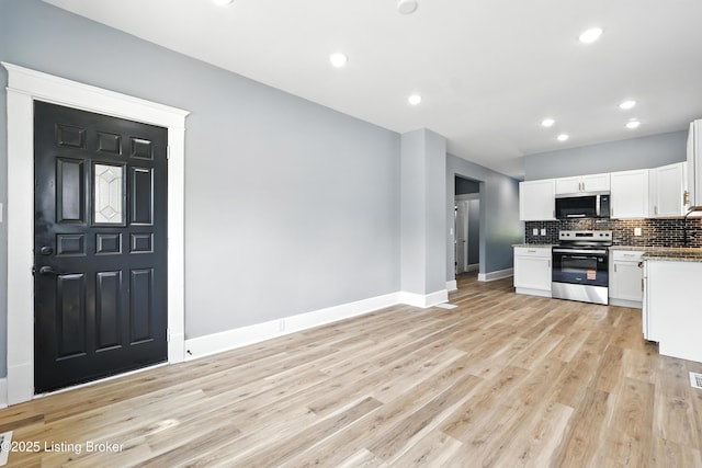 220 N 39th St, Louisville, KY 40212 - kitchen with stainless steel appliances, decorative backsplash, white cabinetry, light wood-type flooring, and recessed lighting