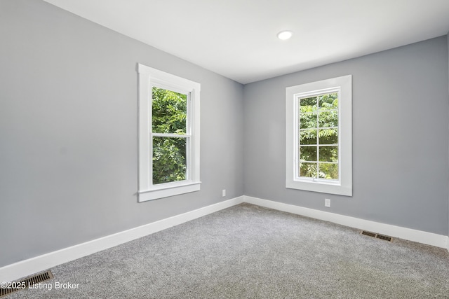220 N 39th St, Louisville, KY 40212 - carpeted empty room with healthy amount of natural light and recessed lighting