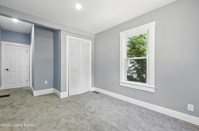 220 N 39th St, Louisville, KY 40212 - unfurnished bedroom with carpet flooring, a closet, and recessed lighting