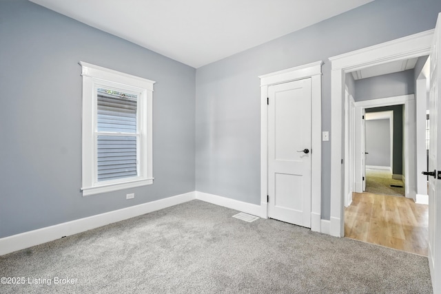 220 N 39th St, Louisville, KY 40212 - unfurnished bedroom featuring carpet floors and baseboards