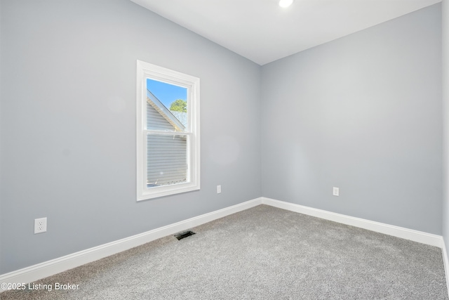 220 N 39th St, Louisville, KY 40212 - carpeted empty room with baseboards