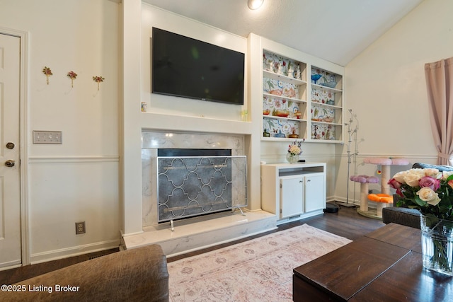 6800 Beard Ct, Louisville, KY 40228 - living area with a high end fireplace, lofted ceiling, and dark wood-style flooring