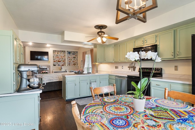 6800 Beard Ct, Louisville, KY 40228 - kitchen featuring black appliances, green cabinets, open floor plan, light countertops, and ceiling fan