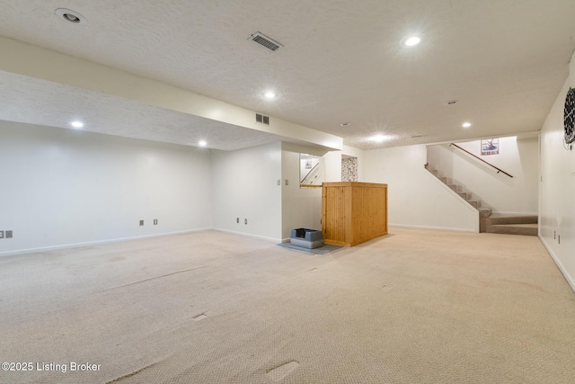 6800 Beard Ct, Louisville, KY 40228 - finished below grade area featuring light carpet, stairs, recessed lighting, and a textured ceiling