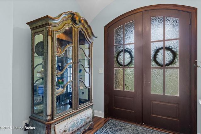 4225 Pleasant Glen Dr, Louisville, KY 40299 - foyer featuring french doors, baseboards, dark wood-type flooring, and arched walkways