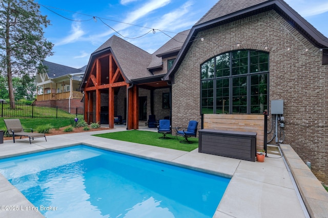 4225 Pleasant Glen Dr, Louisville, KY 40299 - back of property featuring brick siding, a patio, and roof with shingles