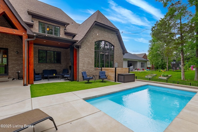4225 Pleasant Glen Dr, Louisville, KY 40299 - back of house featuring brick siding, an outdoor hangout area, a patio, and roof with shingles