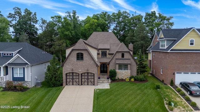 4225 Pleasant Glen Dr, Louisville, KY 40299 - view of front facade featuring driveway, a front lawn, a garage, and central air condition unit