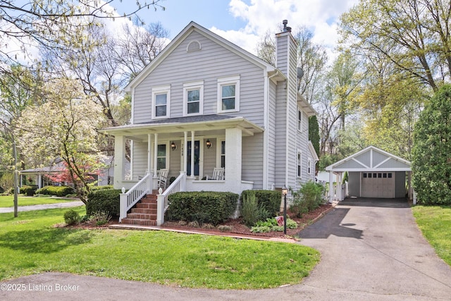 7408 Floydsburg Rd, Crestwood, KY 40014 - view of front facade with a chimney, an outdoor structure, a porch, a detached garage, and a front yard