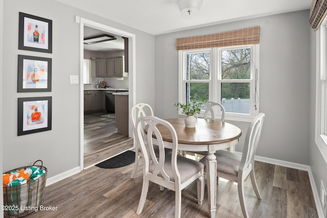 7408 Floydsburg Rd, Crestwood, KY 40014 - dining area with baseboards and dark wood-type flooring