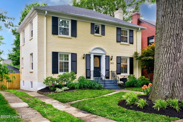 2417 Meadow Rd, Seneca Gardens, KY 40205 - view of front of home with brick siding, a chimney, and a shingled roof