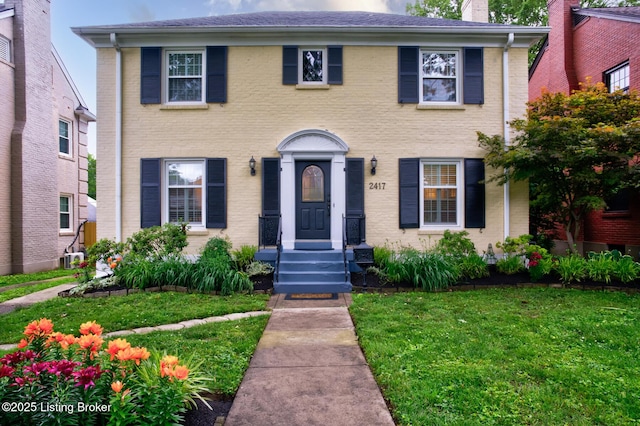 2417 Meadow Rd, Seneca Gardens, KY 40205 - view of front of property featuring a front yard, a chimney, and brick siding