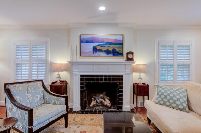 2417 Meadow Rd, Seneca Gardens, KY 40205 - living area with ornamental molding, baseboards, a tile fireplace, wood finished floors, and recessed lighting