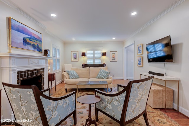 2417 Meadow Rd, Seneca Gardens, KY 40205 - living room with wood finished floors, recessed lighting, baseboards, ornamental molding, and a tiled fireplace