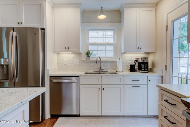 2417 Meadow Rd, Seneca Gardens, KY 40205 - kitchen featuring appliances with stainless steel finishes, a sink, backsplash, and white cabinets