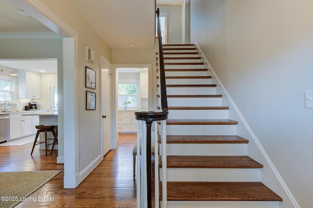 2417 Meadow Rd, Seneca Gardens, KY 40205 - stairs featuring healthy amount of natural light, wood finished floors, and baseboards