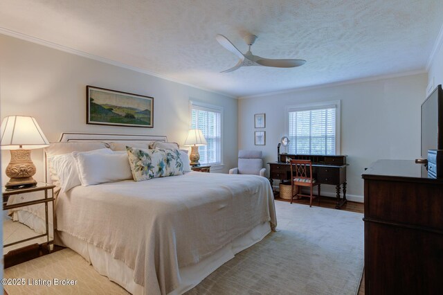 2417 Meadow Rd, Seneca Gardens, KY 40205 - bedroom with multiple windows, crown molding, light wood-type flooring, a ceiling fan, and baseboards
