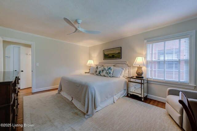 2417 Meadow Rd, Seneca Gardens, KY 40205 - bedroom featuring wood finished floors, crown molding, baseboards, and ceiling fan