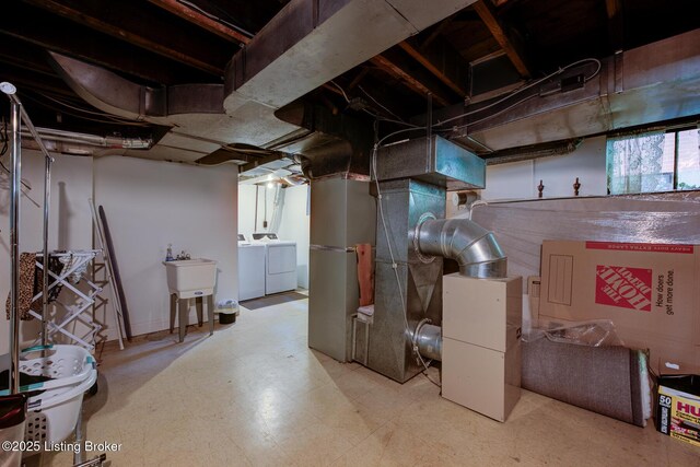 2417 Meadow Rd, Seneca Gardens, KY 40205 - below grade area featuring separate washer and dryer, a sink, and tile patterned floors